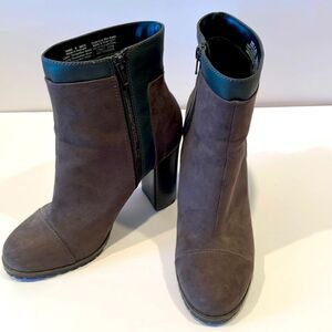 Juicy couture heeled boots in a size 8 medium with approximately a 4 inch heel